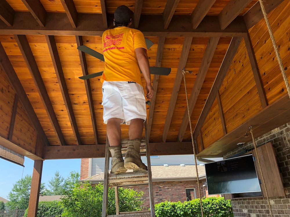 deck medic worker fixing wood ceiling
